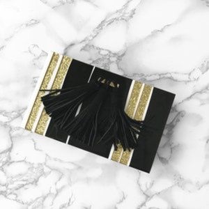ISTI black and gold clutch